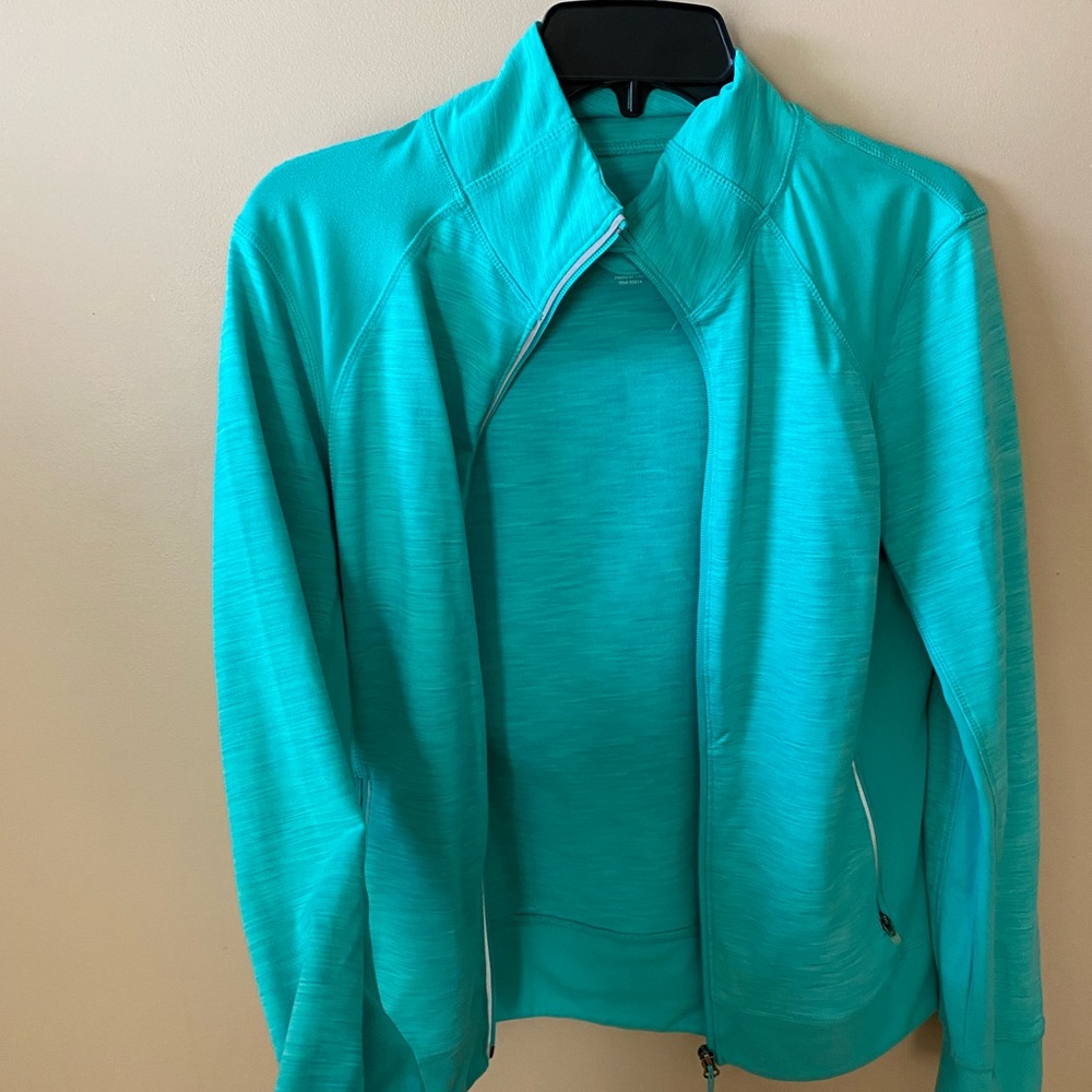Size medium. Very pretty blue, green color. Has thumb holes